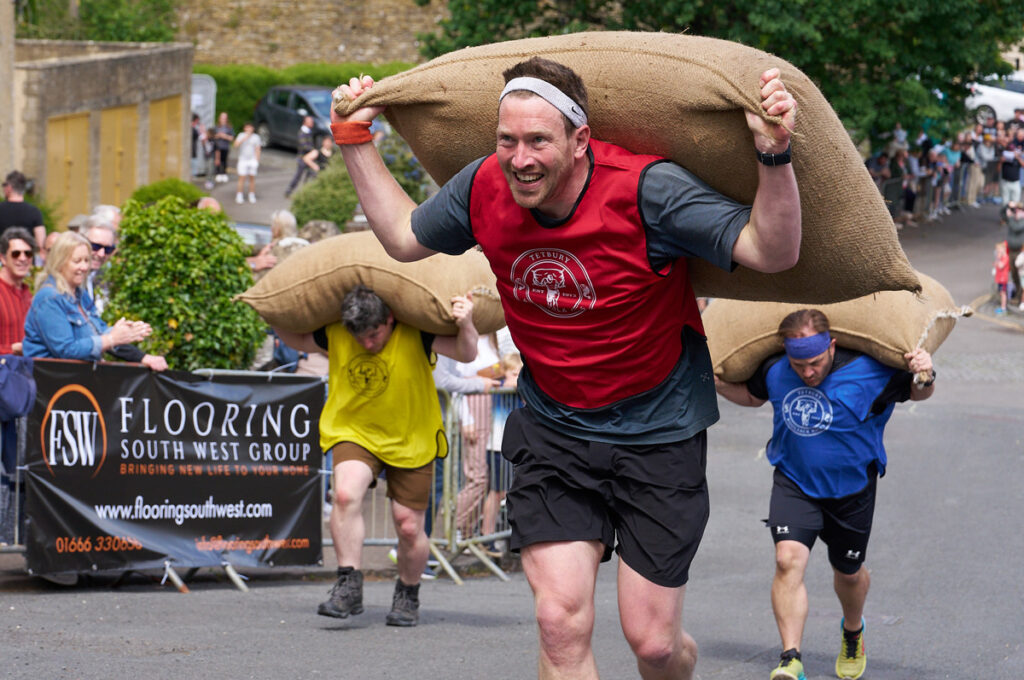 Tetbury Woolsack Races. Carrying Heavy Sacks Up Steep Hills in Gloucestershire, England