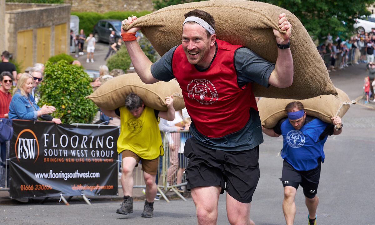 Tetbury Woolsack Races. Carrying Heavy Sacks Up Steep Hills in Gloucestershire, England